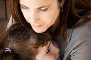 Mother holding daughter (series)