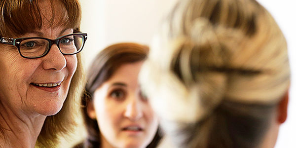 Group of three women working together