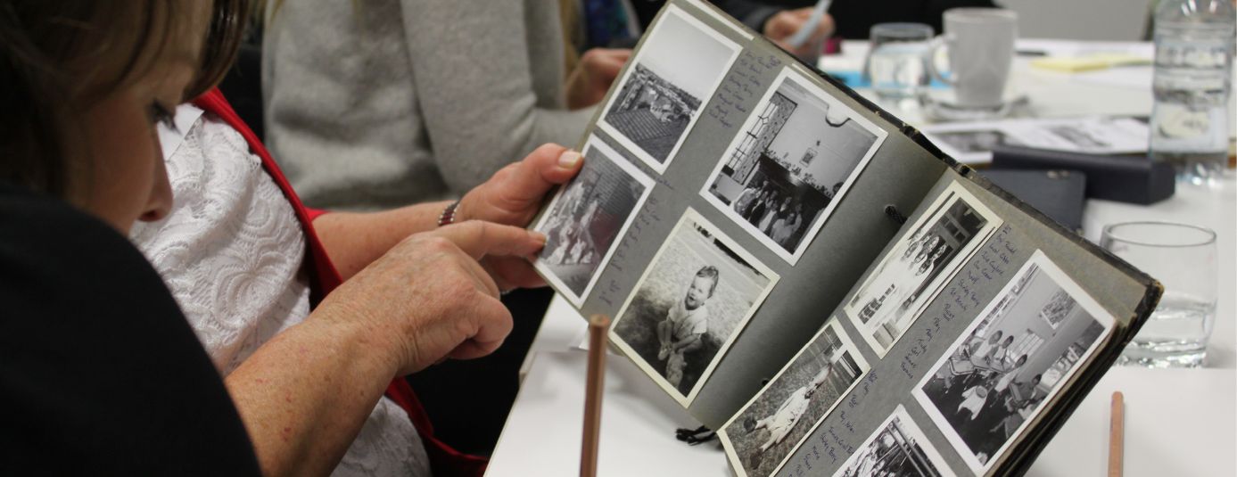 Andrew flipping through old photo book