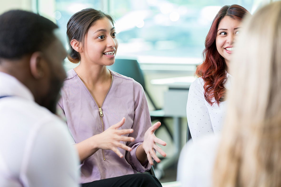 Community mental health Confident woman shares thoughts with colleagues