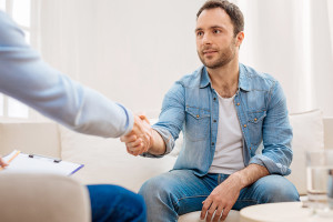 Pleasant good looking man visiting psychologist